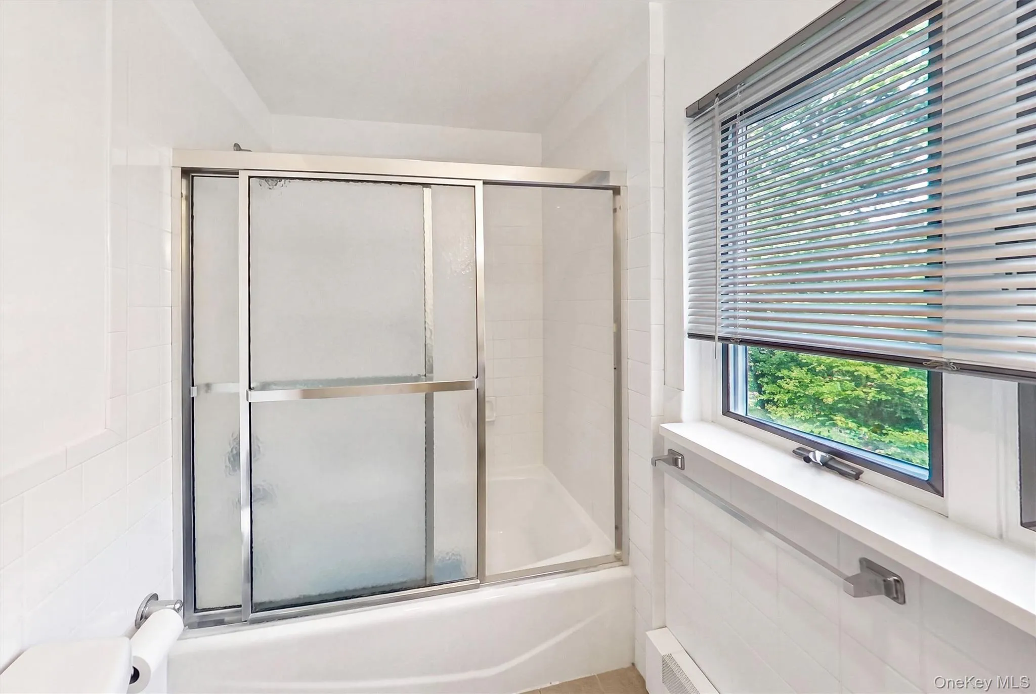 Bathroom with tub, adjacent to the primary bedroom. Bathroom with tub, adjacent to the primary bedroom.