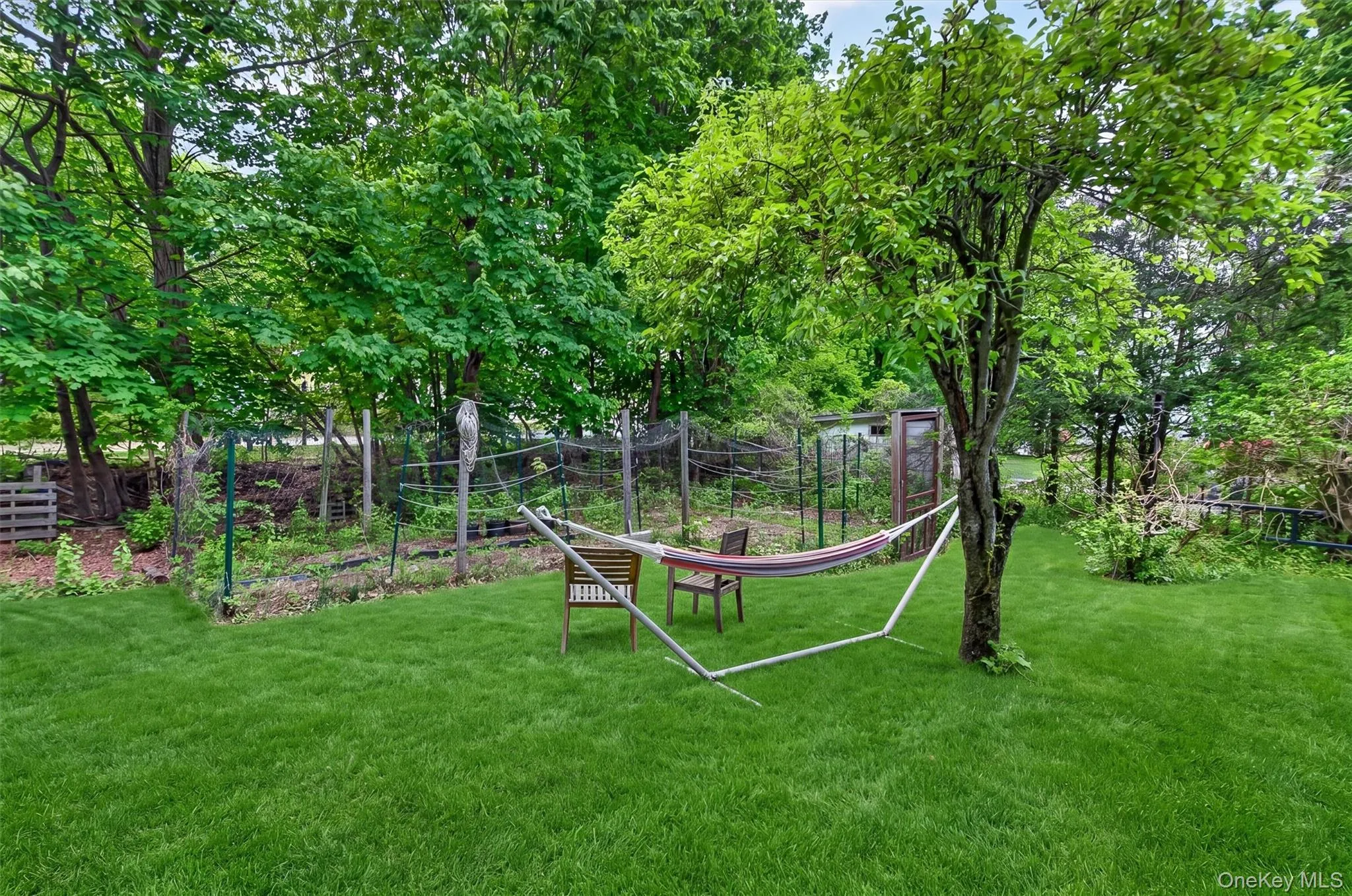 Fenced vegetable garden offers dedicated space for seasonal planting and homegrown harvests. Fenced vegetable garden offers dedicated space for seasonal planting and homegrown harvests.
