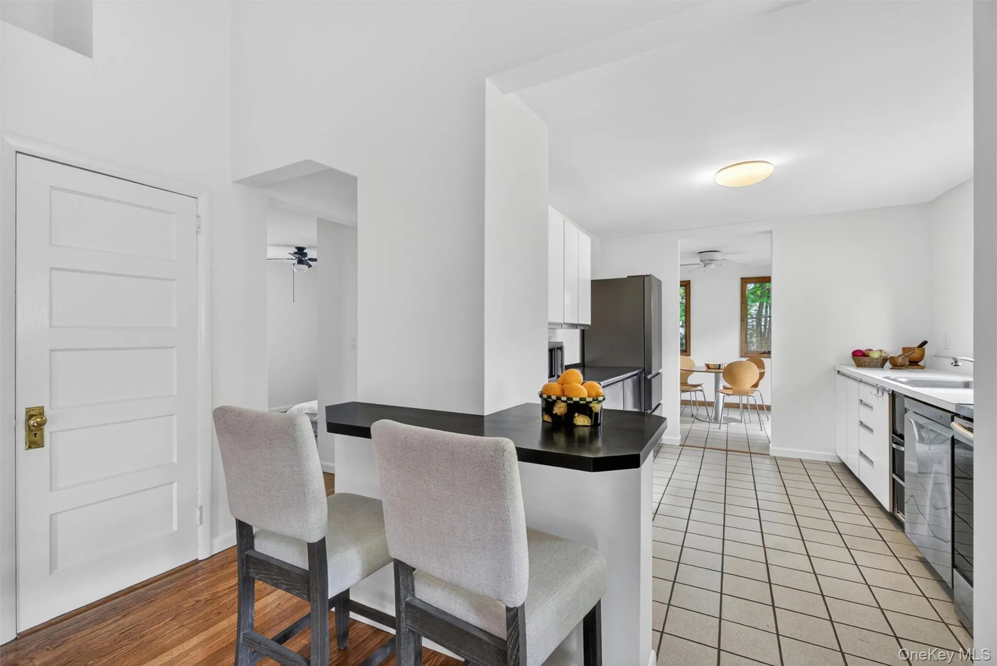 The living room opens to a wide corridor layout kitchen with a small yet useful peninsula. The living room opens to a wide corridor layout kitchen with a small yet useful peninsula.