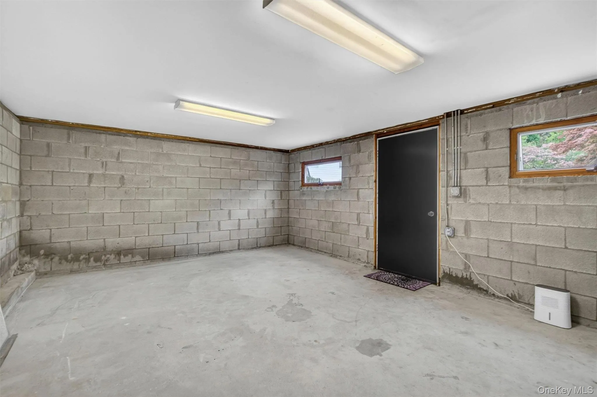 A second ground-level basement/storage room, with a separate entrance off the driveway, adds even more storage space, perfect for bikes and equipment. A second ground-level basement/storage room, with a separate entrance off the driveway, adds even more storage space, perfect for bikes and equipment.