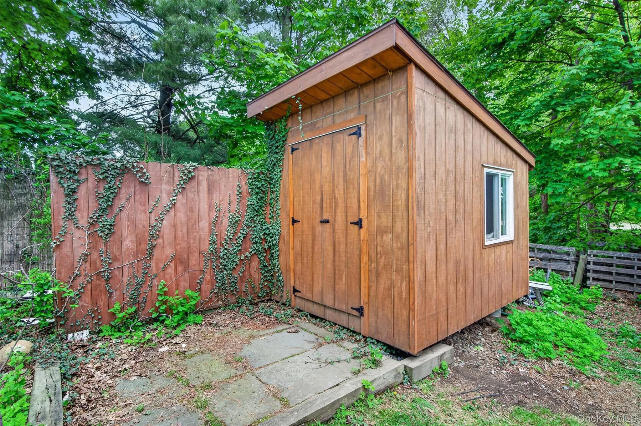 Custom-built shed adds even more versatile storage or workspace potential to the property. Custom-built shed adds even more versatile storage or workspace potential to the property.