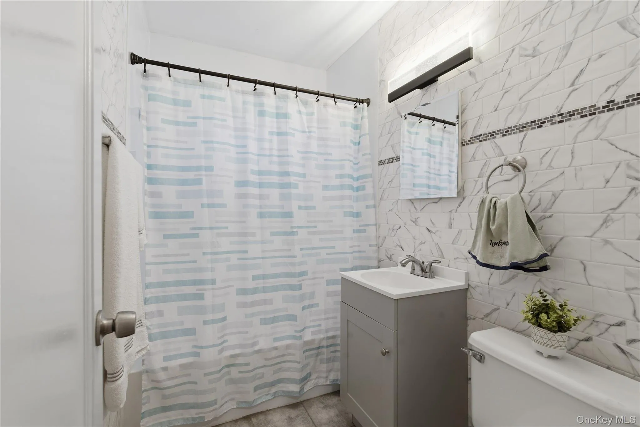 Renovated bathroom featuring Renovated bathroom featuring