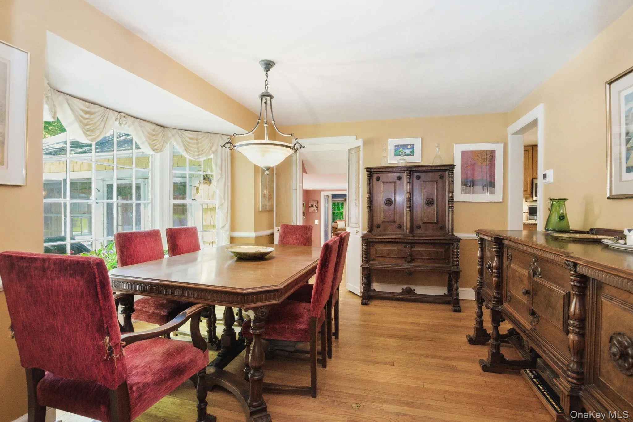The dining room's bay window, hardwood floors, and sightline through to the family room make it a natural hub for the main floor. The dining room's bay window, hardwood floors, and sightline through to the family room make it a natural hub for the main floor.