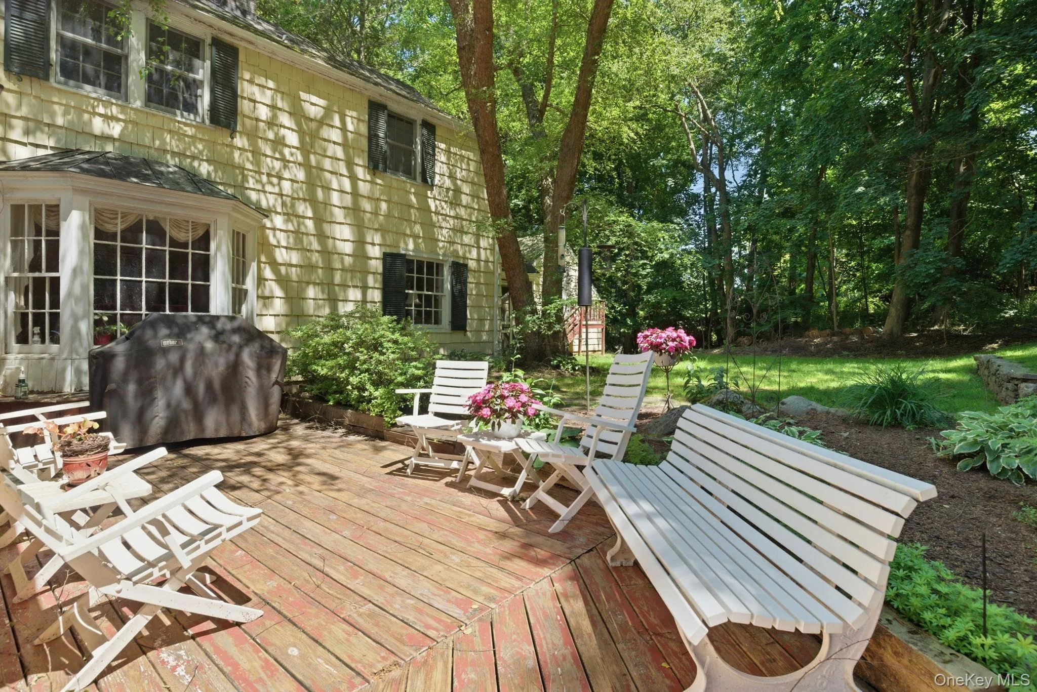 The rear deck off the family room provides direct outdoor access with room for seating and entertaining surrounded by mature trees. The rear deck off the family room provides direct outdoor access with room for seating and entertaining surrounded by mature trees.