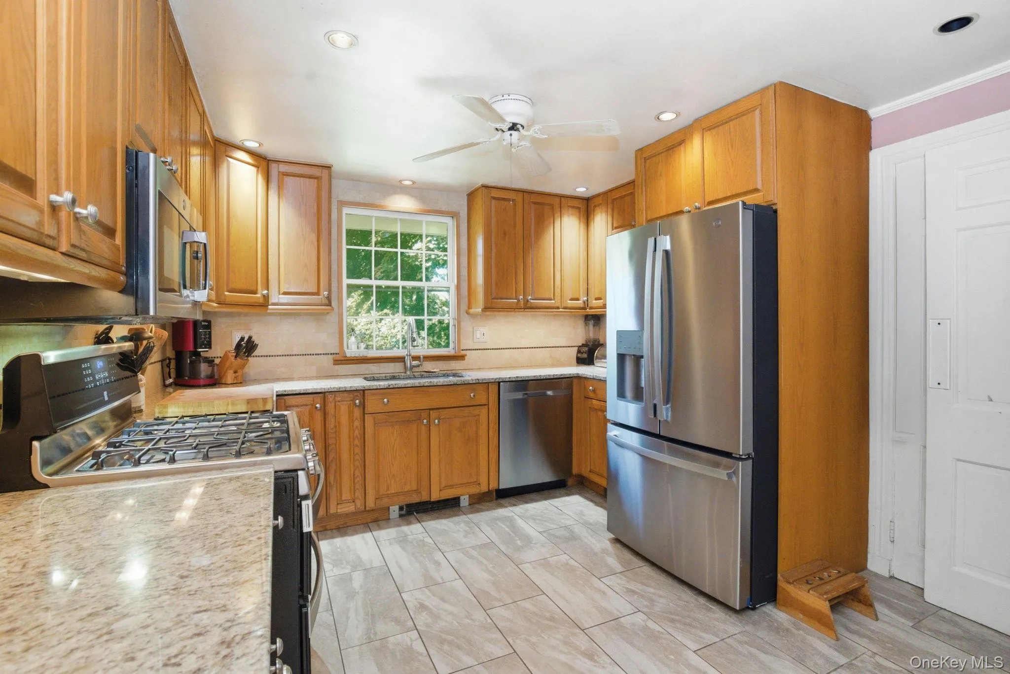 The updated kitchen features granite countertops, wood cabinetry and stainless steel appliances. The updated kitchen features granite countertops, wood cabinetry and stainless steel appliances.