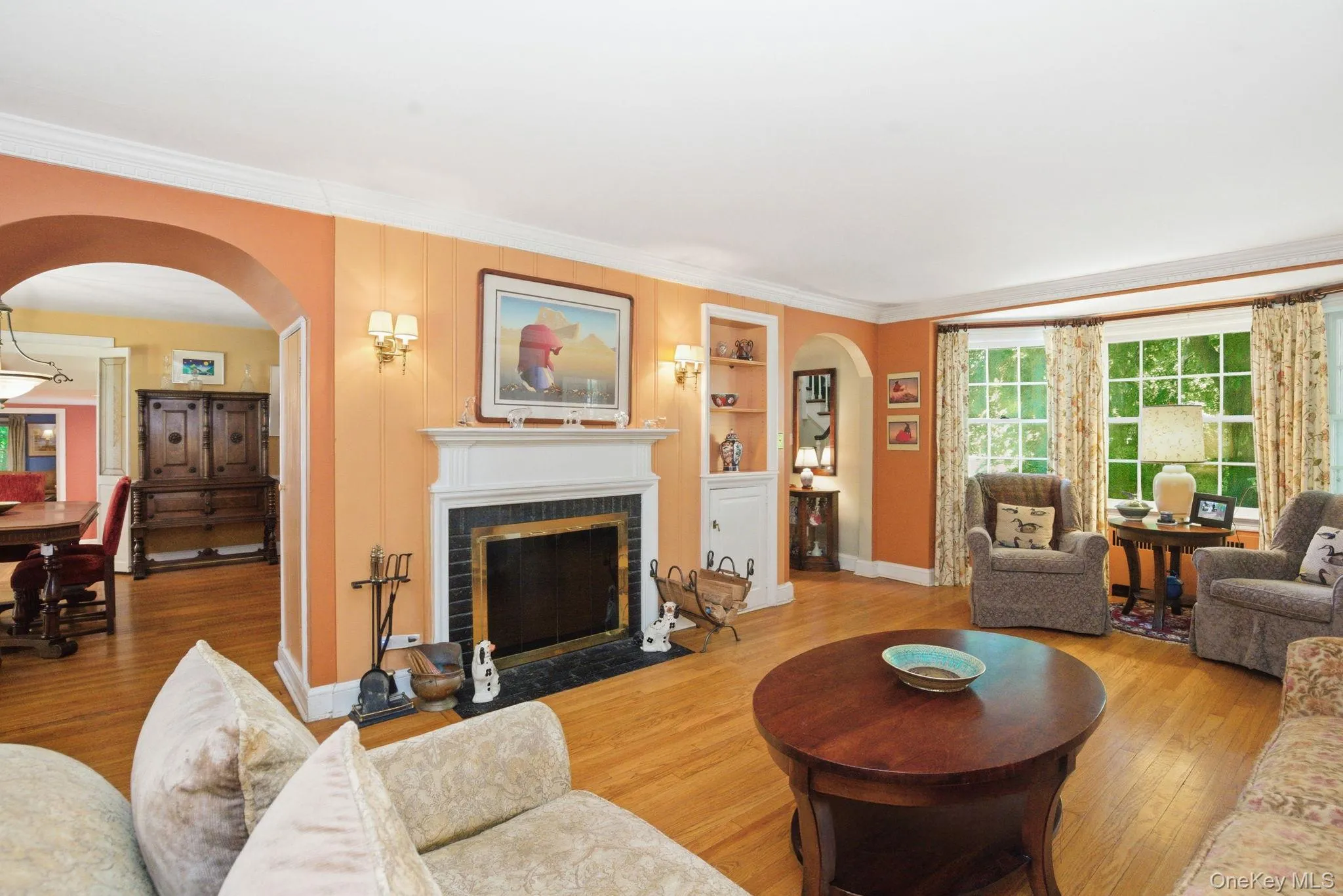 Crown molding, natural woodwork, and an open sightline to the formal dining room highlight the classic character of this 1934 Colonial. Crown molding, natural woodwork, and an open sightline to the formal dining room highlight the classic character of this 1934 Colonial.
