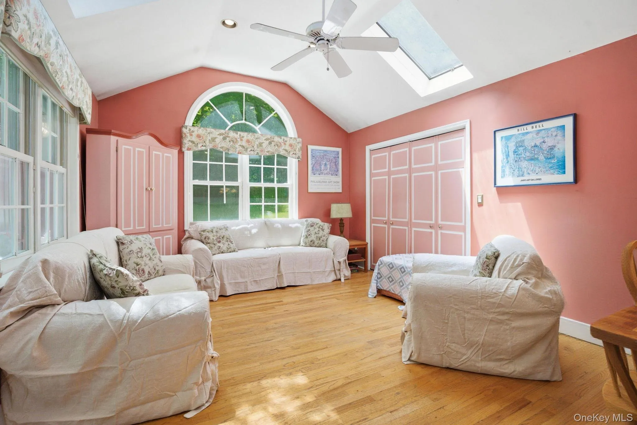 Dual skylights, a vaulted ceiling, an arched window, and hardwood floors give this family room standout volume and light. Dual skylights, a vaulted ceiling, an arched window, and hardwood floors give this family room standout volume and light.