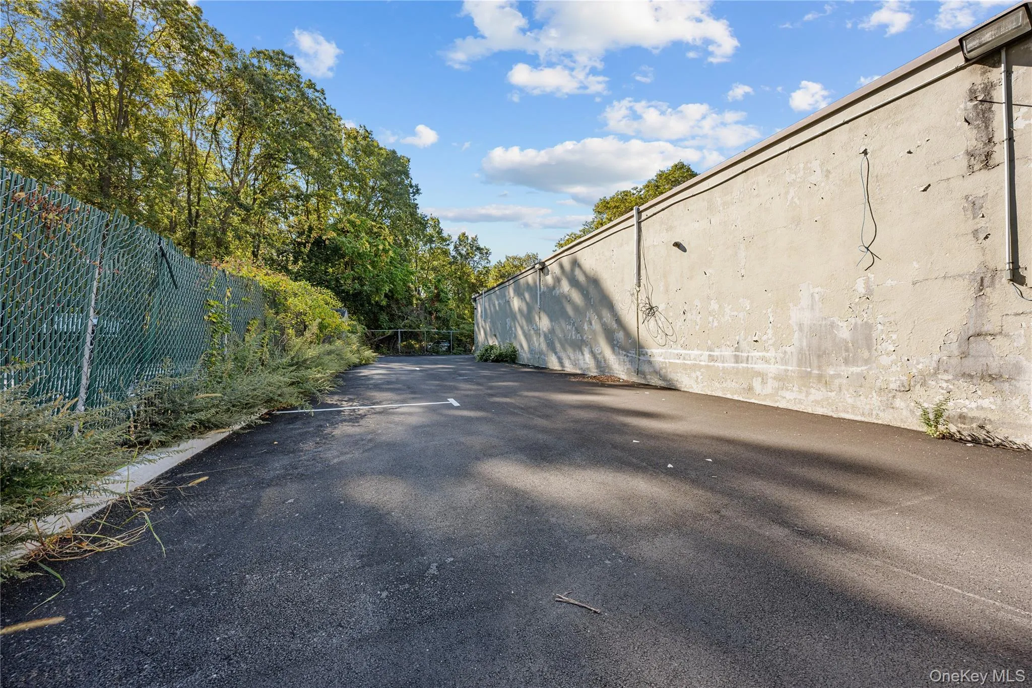 View of asphalt driveway View of asphalt driveway