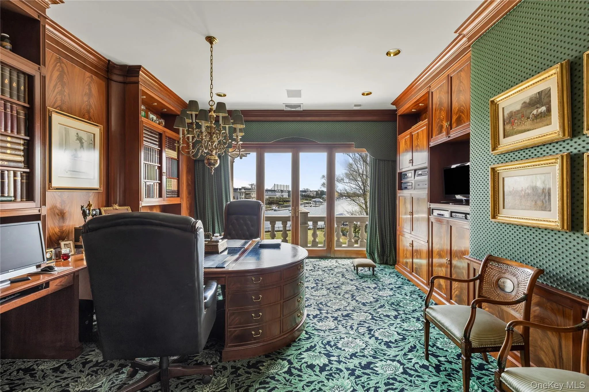 Formal study featuring rich wood-paneled walls with integrated shelving and cabinetry Formal study featuring rich wood-paneled walls with integrated shelving and cabinetry