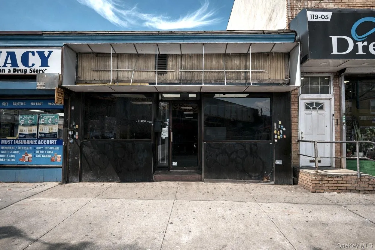 Commercial storefront with a recessed entry door and two expansive display windows Commercial storefront with a recessed entry door and two expansive display windows