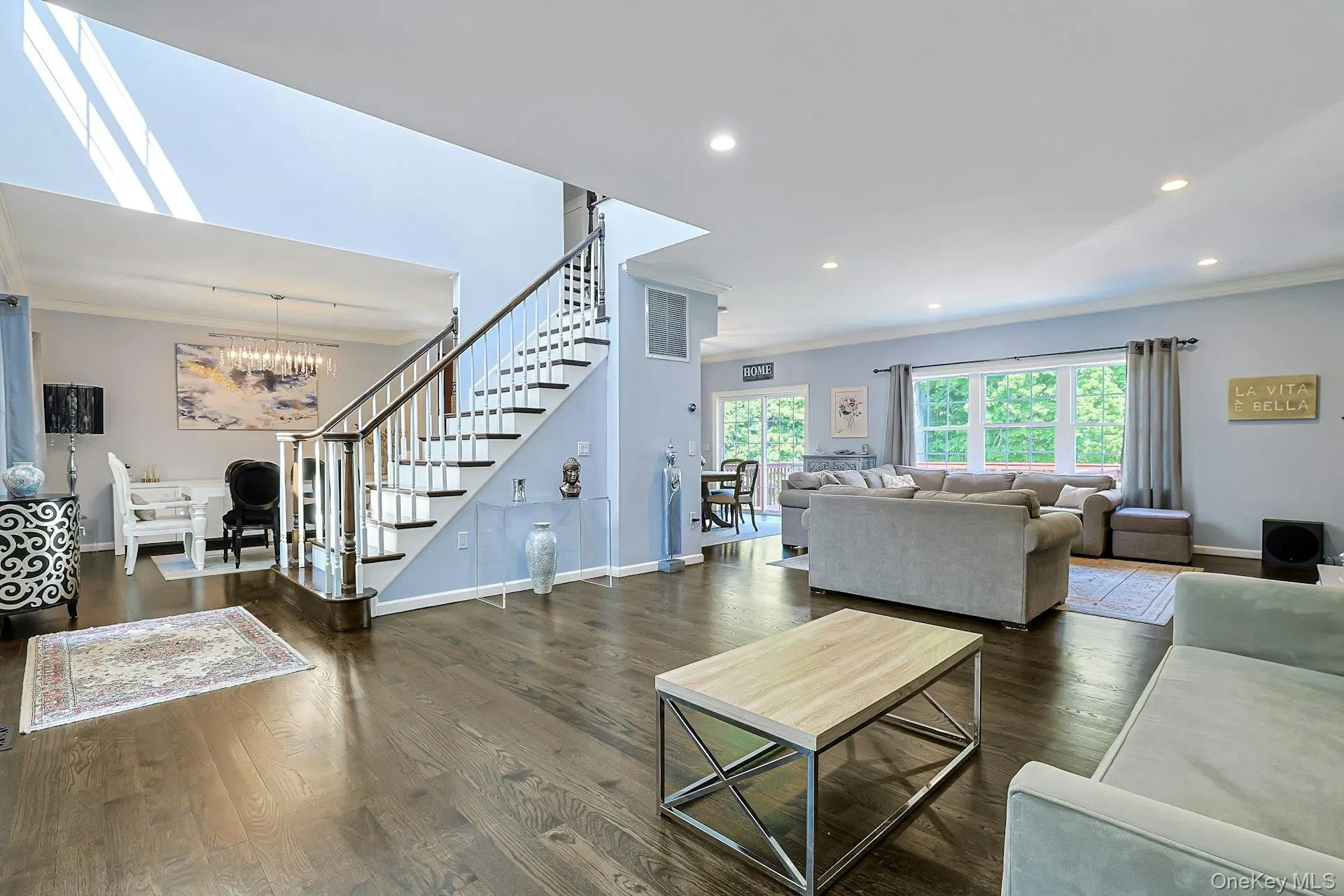 Spacious open concept living room. The seamless flow between living areas creates an airy and inviting atmosphere. Spacious open concept living room. The seamless flow between living areas creates an airy and inviting atmosphere.