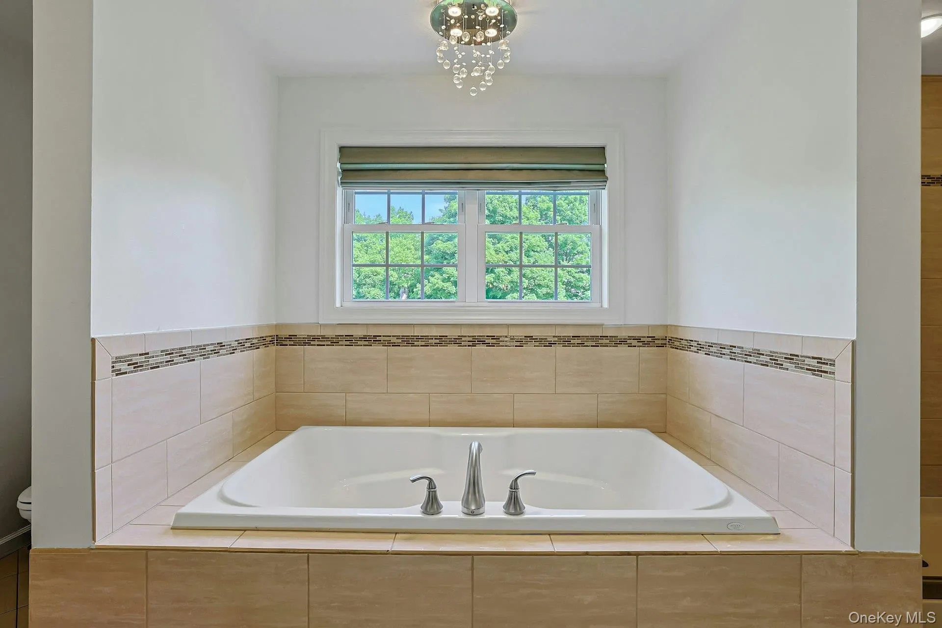 Soaking tub in the primary bathroom creates a calm and comfortable place to relax. Soaking tub in the primary bathroom creates a calm and comfortable place to relax.