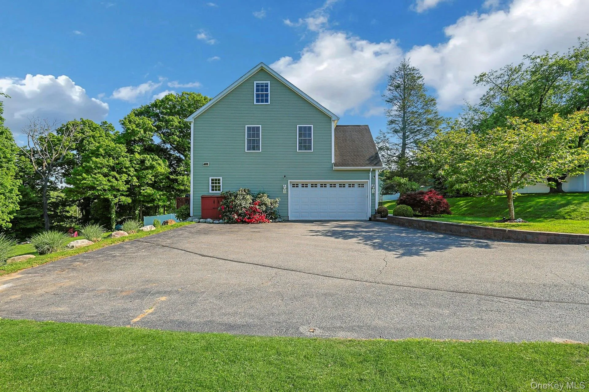Two car garage and generous driveway with parking for over ten additional cars! Easy entertaining and gatherings. Who has that?! Two car garage and generous driveway with parking for over ten additional cars! Easy entertaining and gatherings. Who has that?!