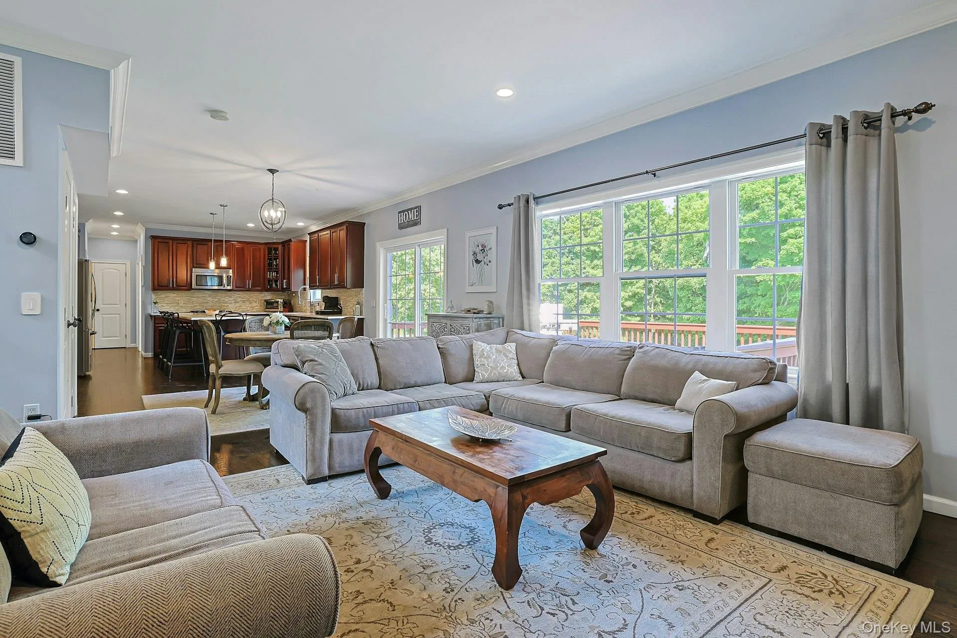 The living room offers a bright, open feel with a natural connection to the kitchen for everyday living and entertaining. The living room offers a bright, open feel with a natural connection to the kitchen for everyday living and entertaining.