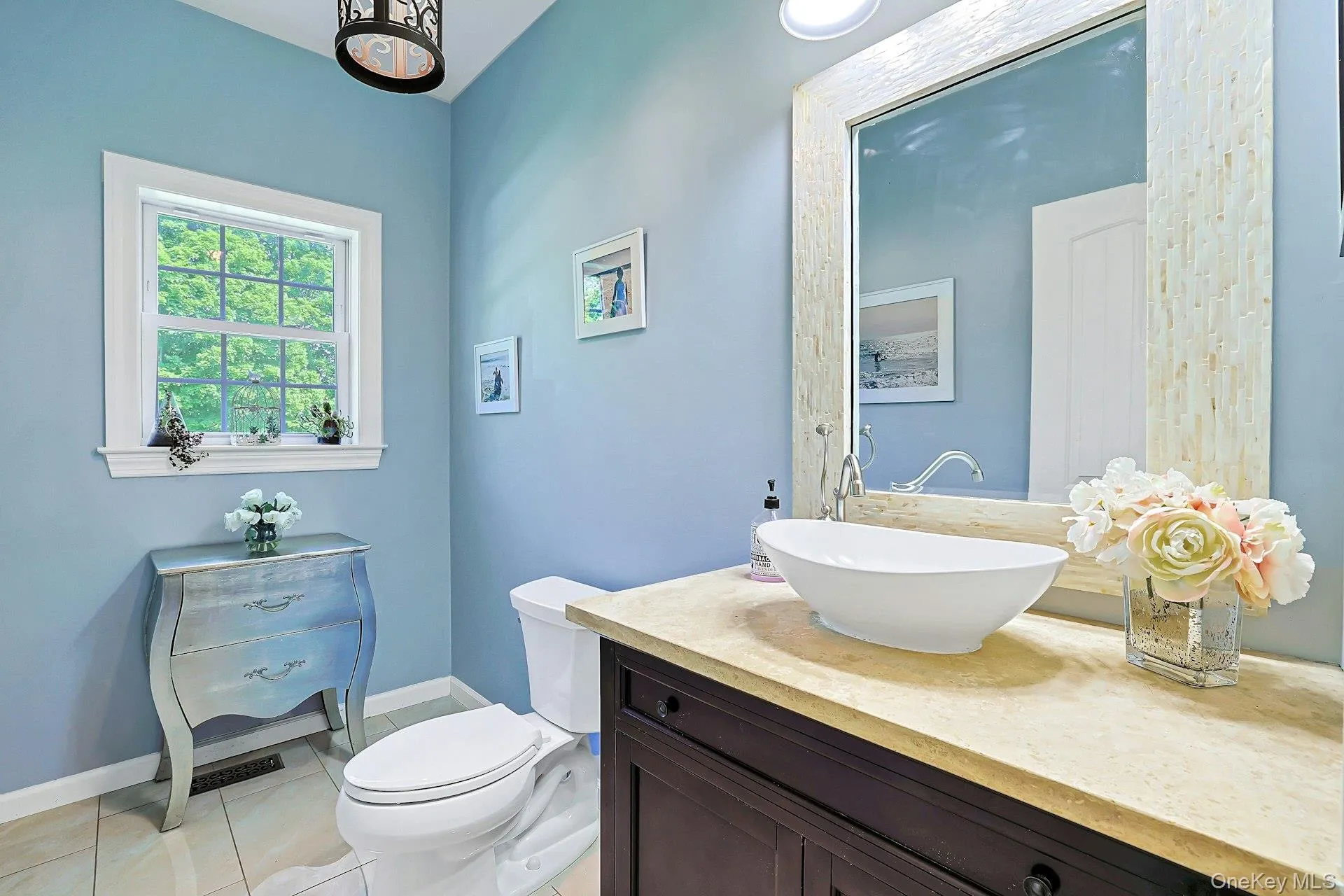 Main-level powder room adjacent to the kitchen. Main-level powder room adjacent to the kitchen.