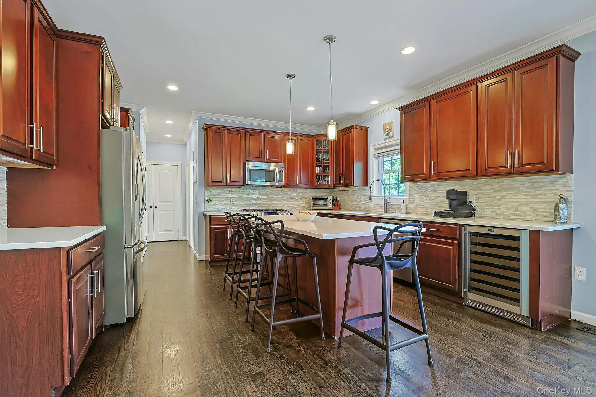 Well-appointed kitchen featuring Merillat 42-inch maple wood cabinetry, Uba tuba granite countertops, stainless steel appliances and crown molding. Well-appointed kitchen featuring Merillat 42-inch maple wood cabinetry, Uba tuba granite countertops, stainless steel appliances and crown molding.