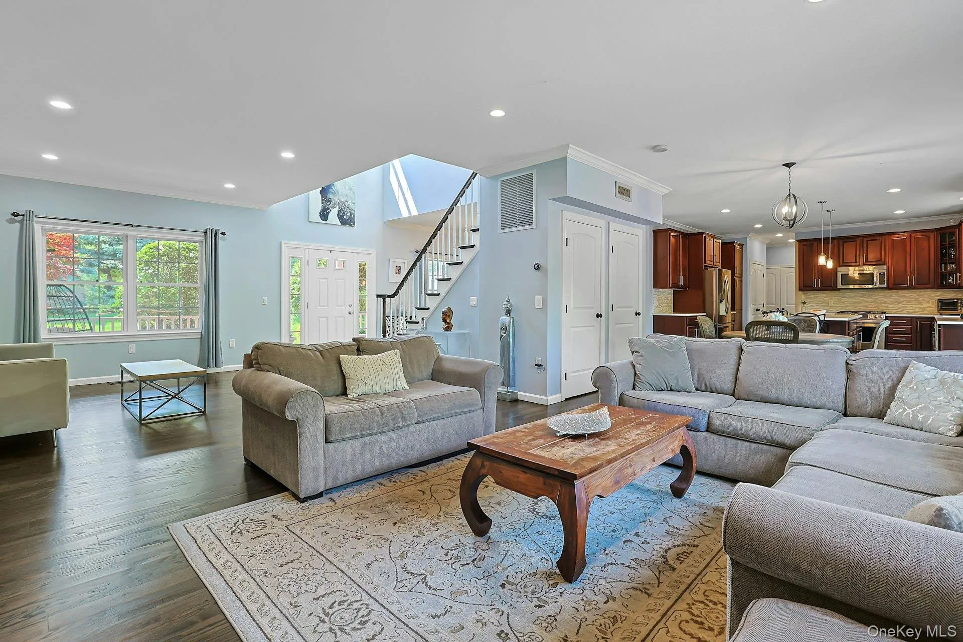 The spacious living room opens directly to the kitchen, offering a comfortable flow between the main living spaces. The spacious living room opens directly to the kitchen, offering a comfortable flow between the main living spaces.