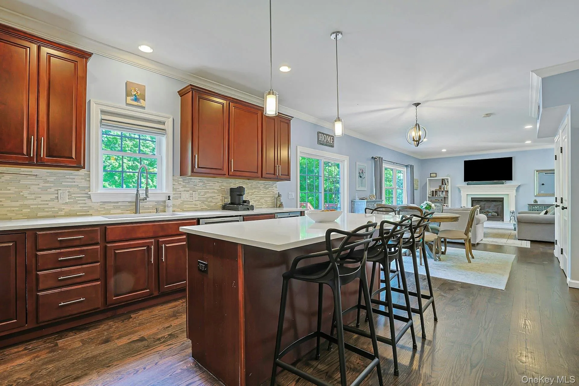 Featuring a center island that adds extra workspace and a comfortable gathering spot. Featuring a center island that adds extra workspace and a comfortable gathering spot.