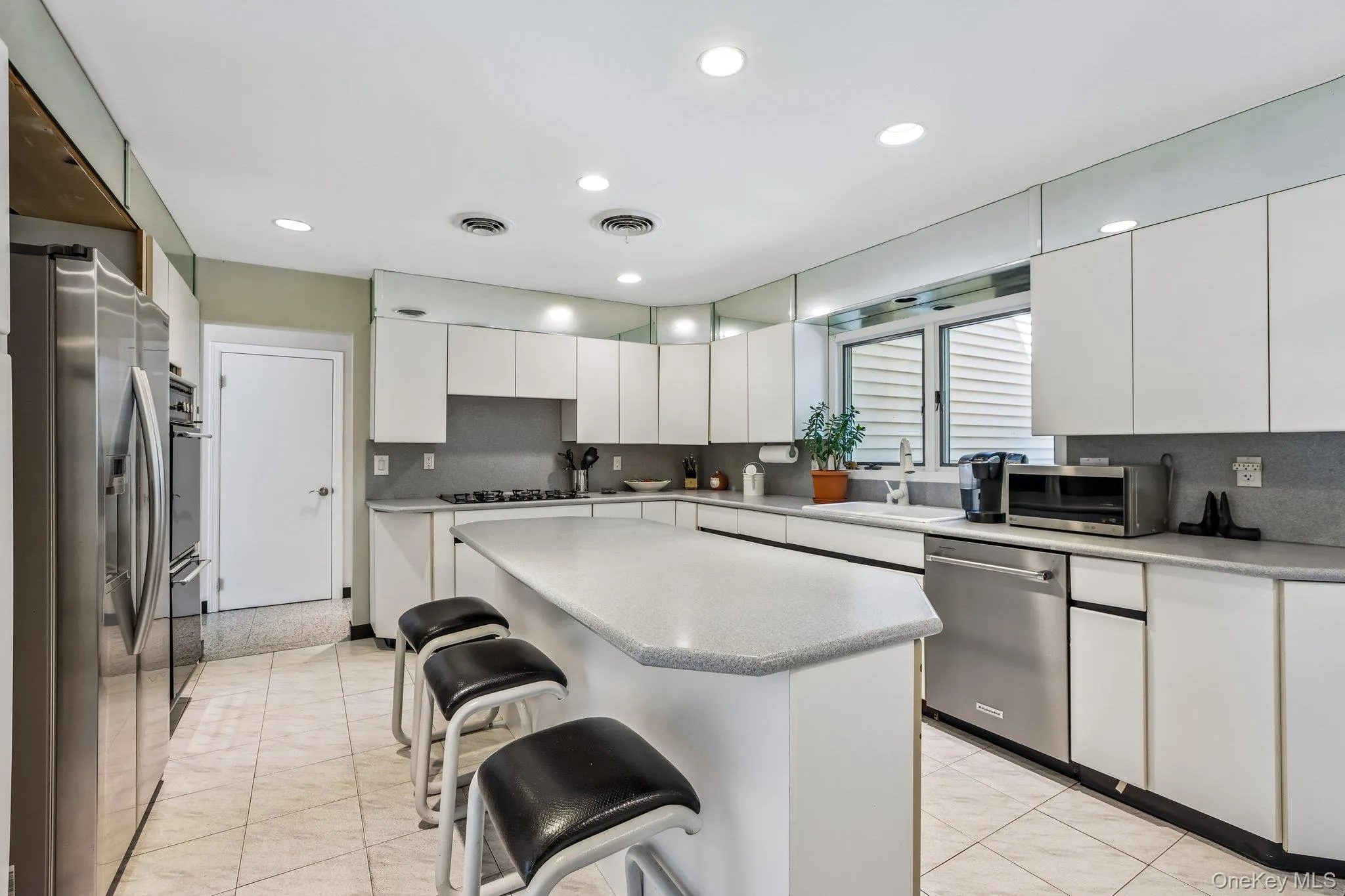 Lots of recessed lighting offers a crisp look Lots of recessed lighting offers a crisp look