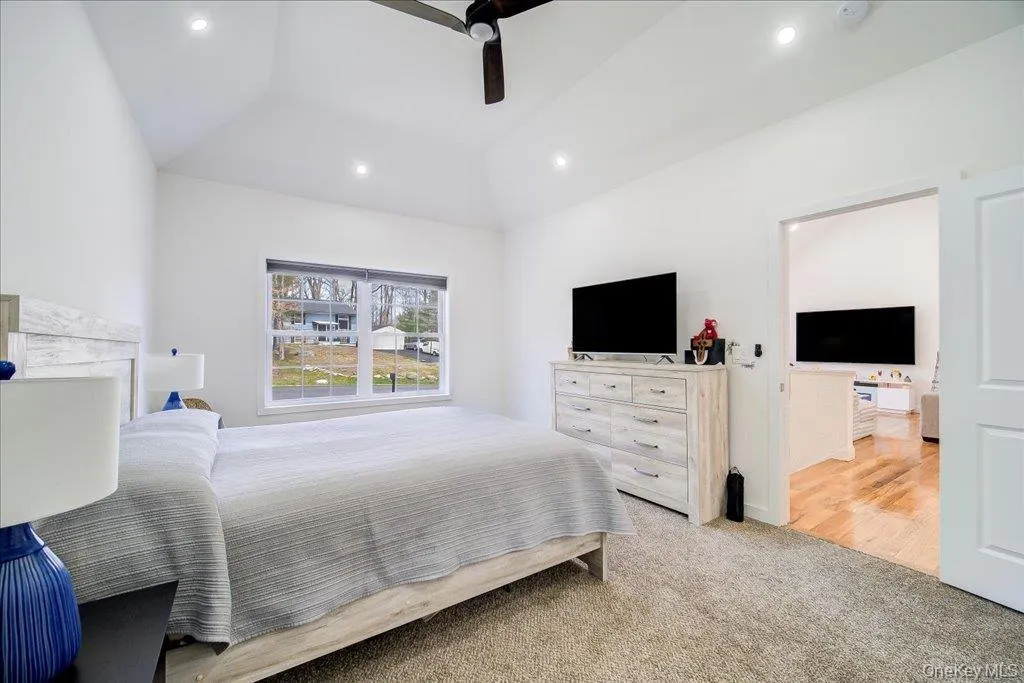 Vaulted ceiling featuring recessed lighting and a ceiling fan Vaulted ceiling featuring recessed lighting and a ceiling fan
