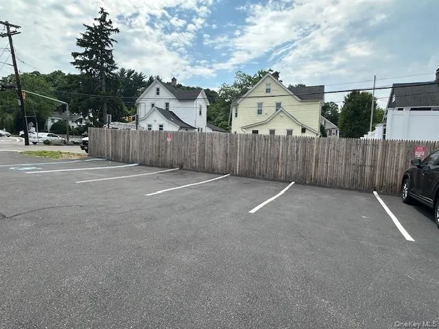 Uncovered parking lot with fence Uncovered parking lot with fence