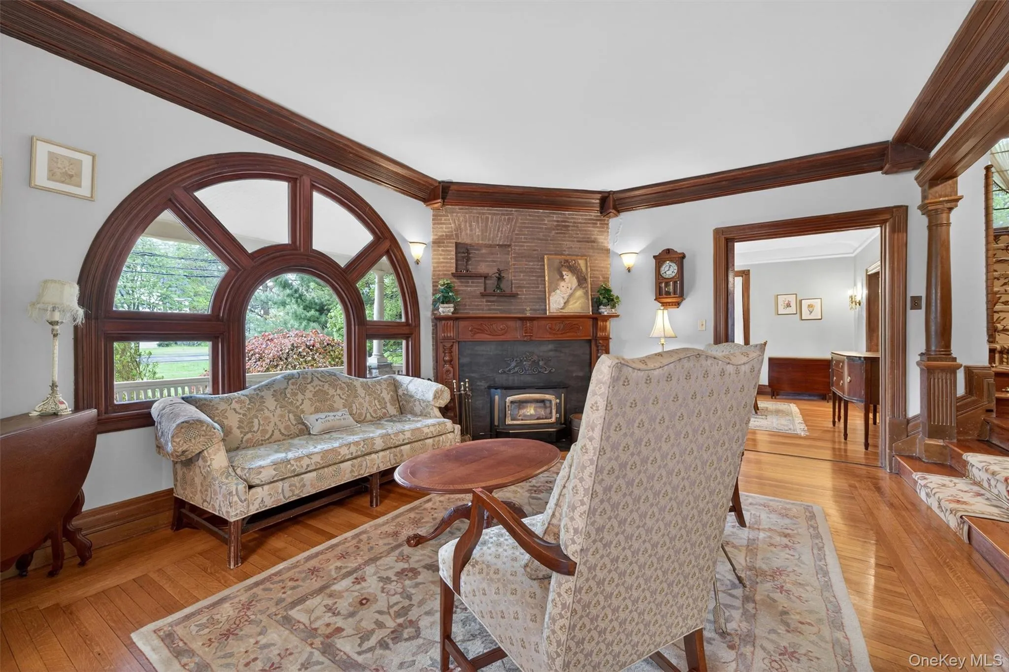A welcoming front parlor is anchored by an amazing custom window... A welcoming front parlor is anchored by an amazing custom window...