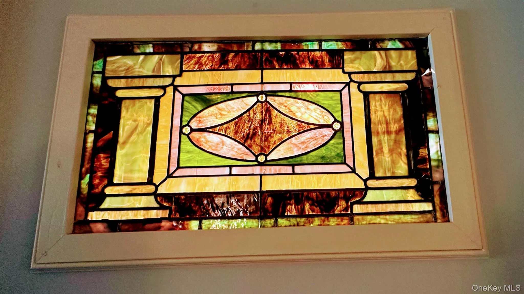 another of the home's built-in stained glass windows both surprise and delight with shifting patterns of light. another of the home's built-in stained glass windows both surprise and delight with shifting patterns of light.