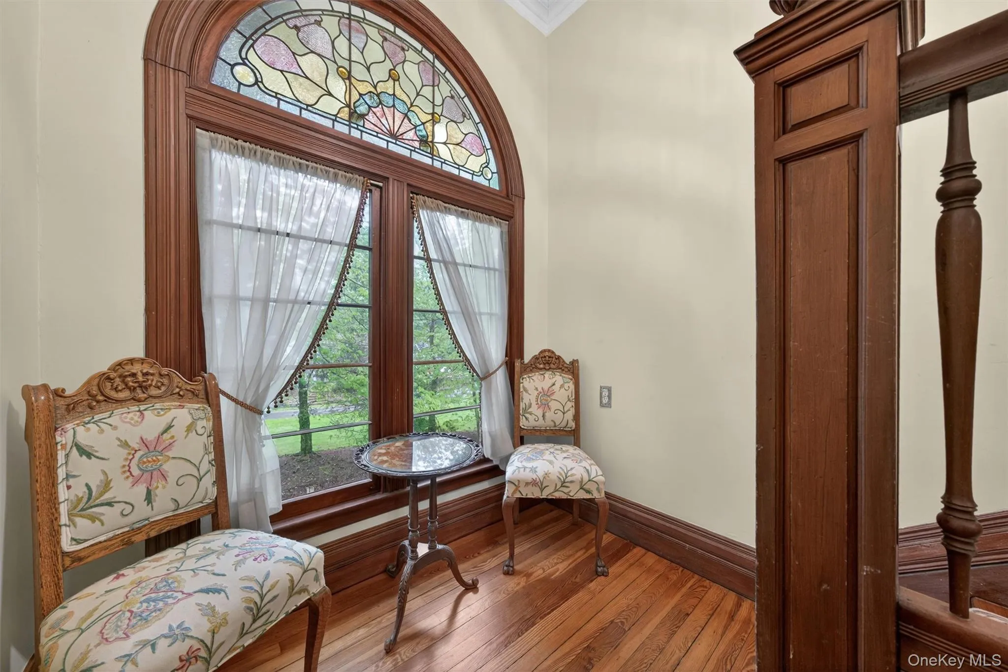 and pause on this huge landing that is big enough to be its own reading nook... and look at the perfect arched stained glass window! and pause on this huge landing that is big enough to be its own reading nook... and look at the perfect arched stained glass window!