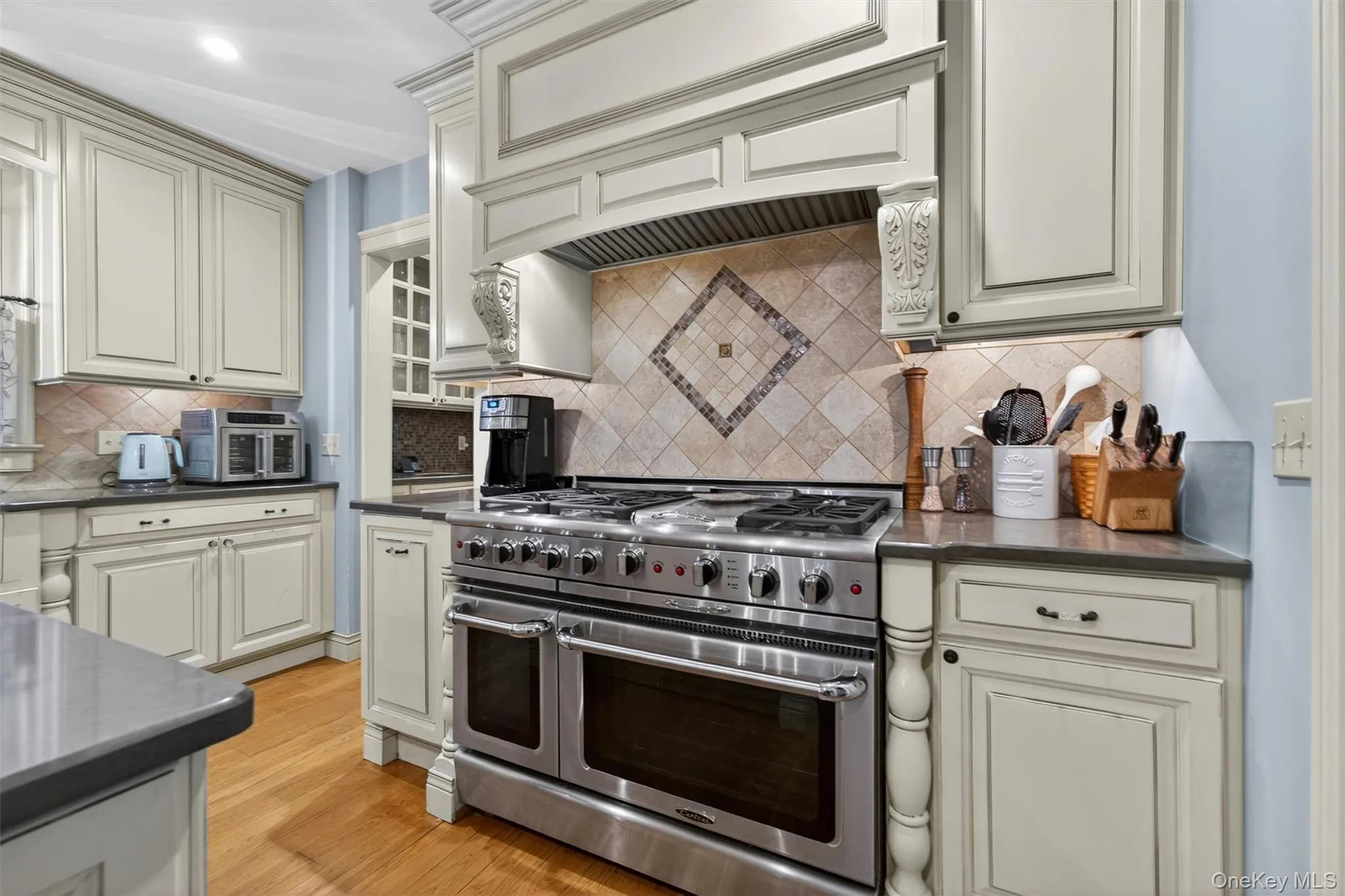 A state-of-the-art Capital brand double gas oven also features a stovetop griddle and tile backsplash... A state-of-the-art Capital brand double gas oven also features a stovetop griddle and tile backsplash...