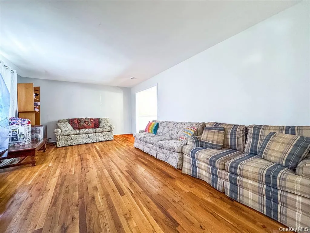 Hardwood flooring extending throughout the room Hardwood flooring extending throughout the room
