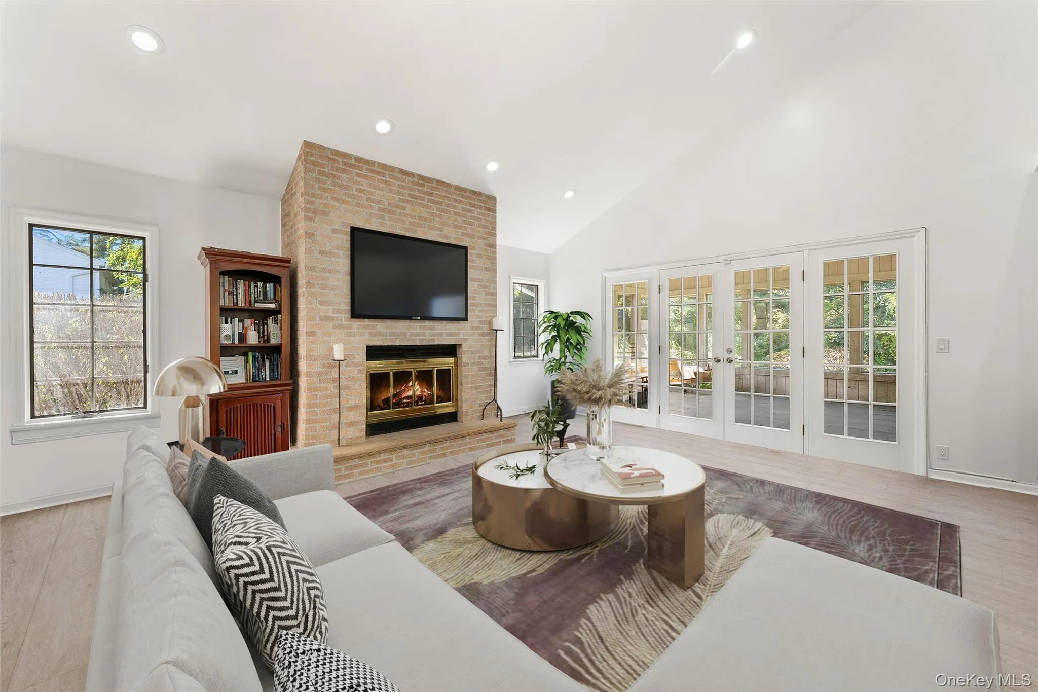 Family room with French doors to the captivating screened in porch. Family room with French doors to the captivating screened in porch.