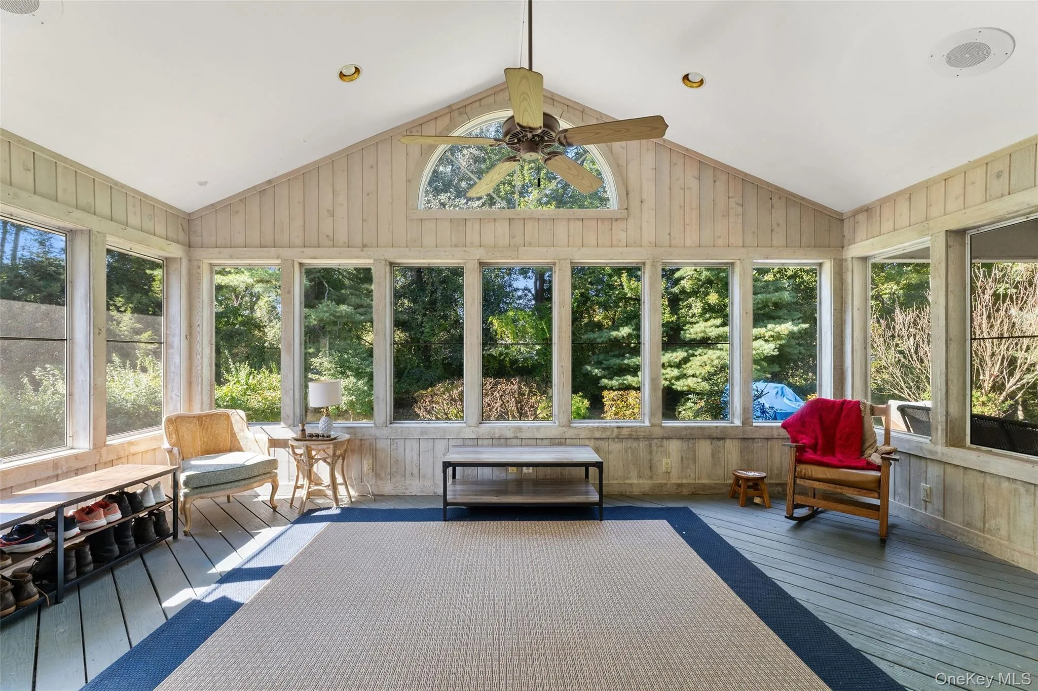 Screened in porch with walls of windows and access to the patio and backyard. Screened in porch with walls of windows and access to the patio and backyard.