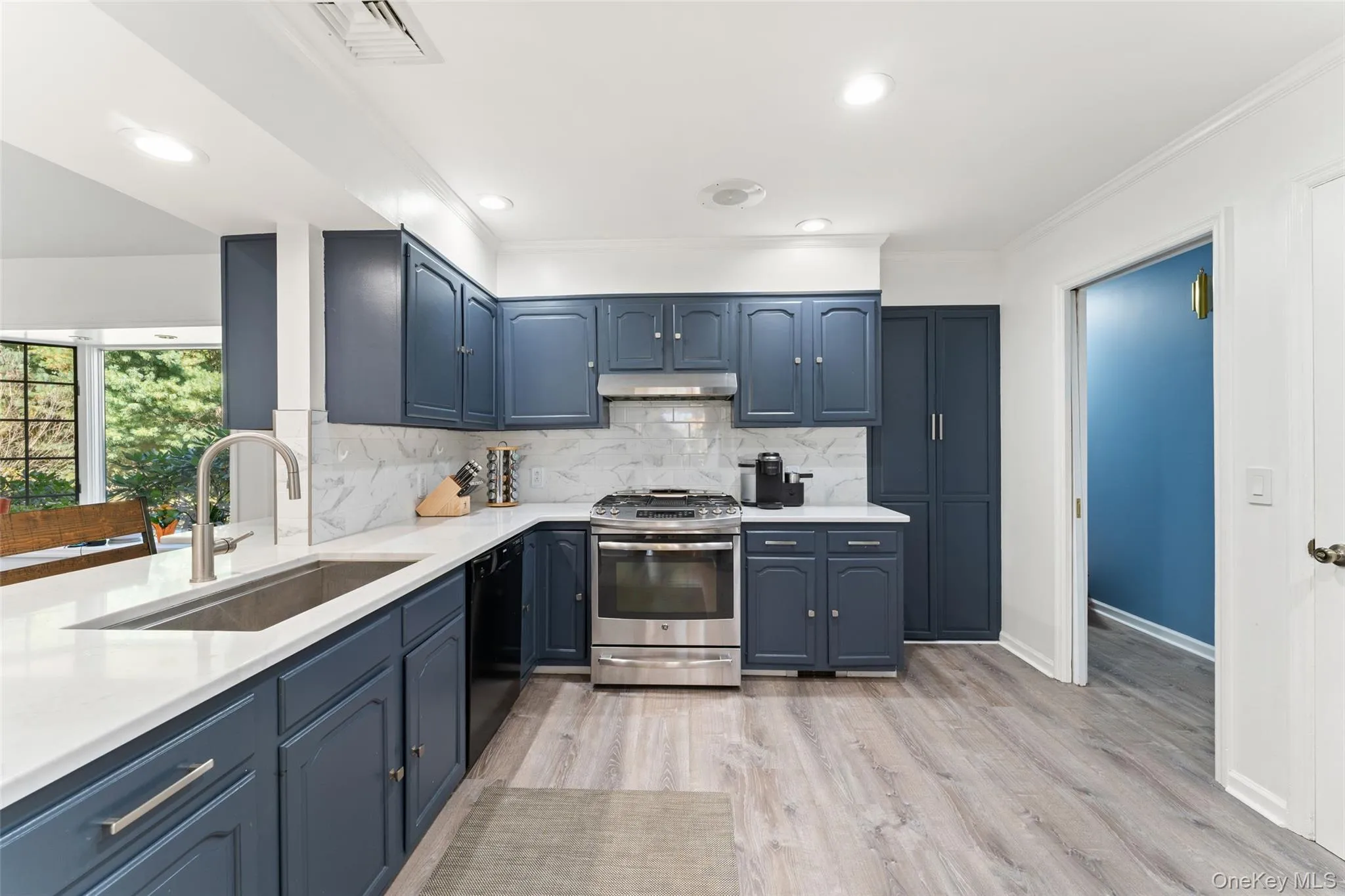 Updated eat-in kitchen with stainless steel appliances and bar seating. Open to the family room. Updated eat-in kitchen with stainless steel appliances and bar seating. Open to the family room.