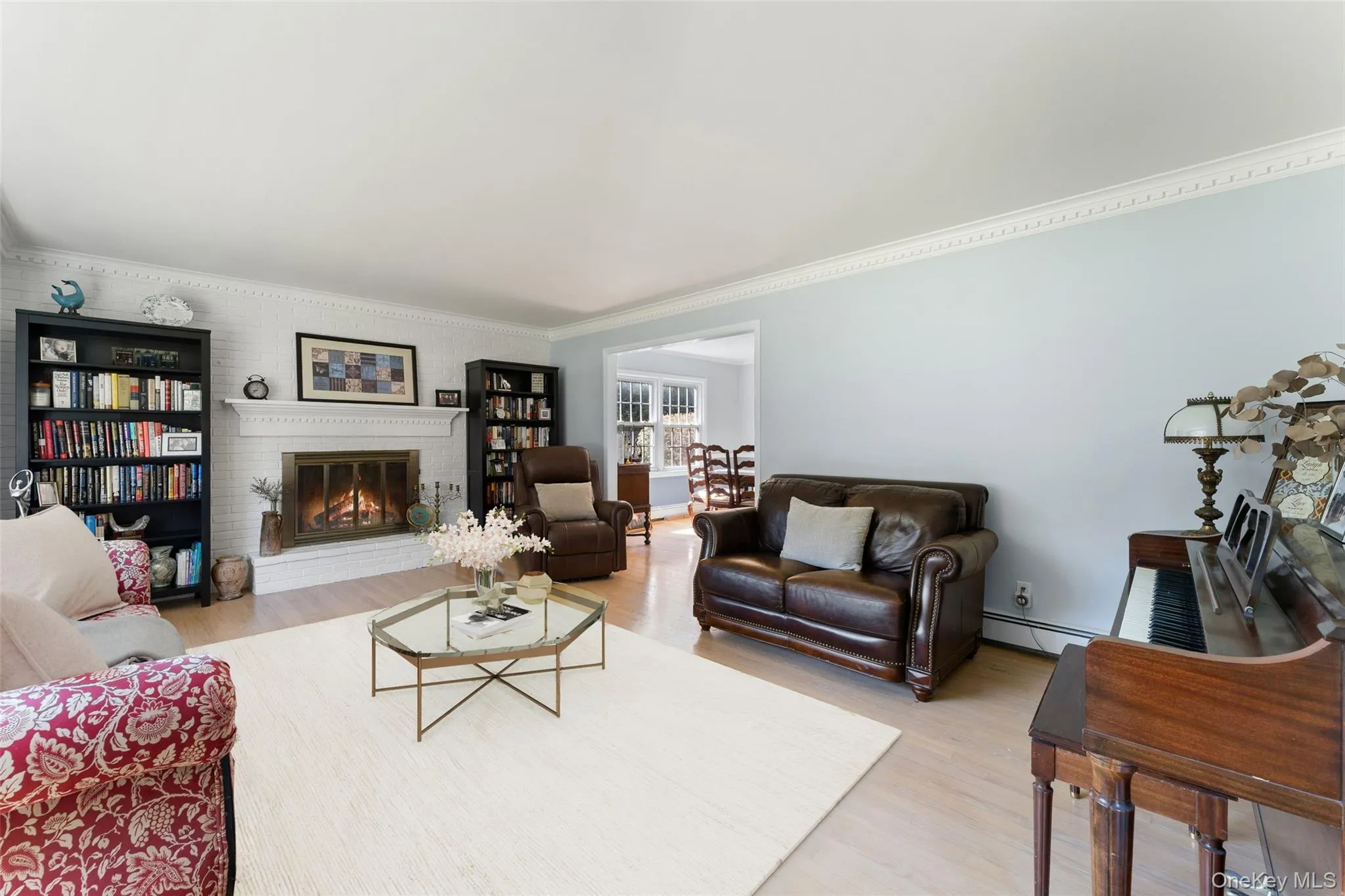 Living room with wood burning fireplace. Living room with wood burning fireplace.