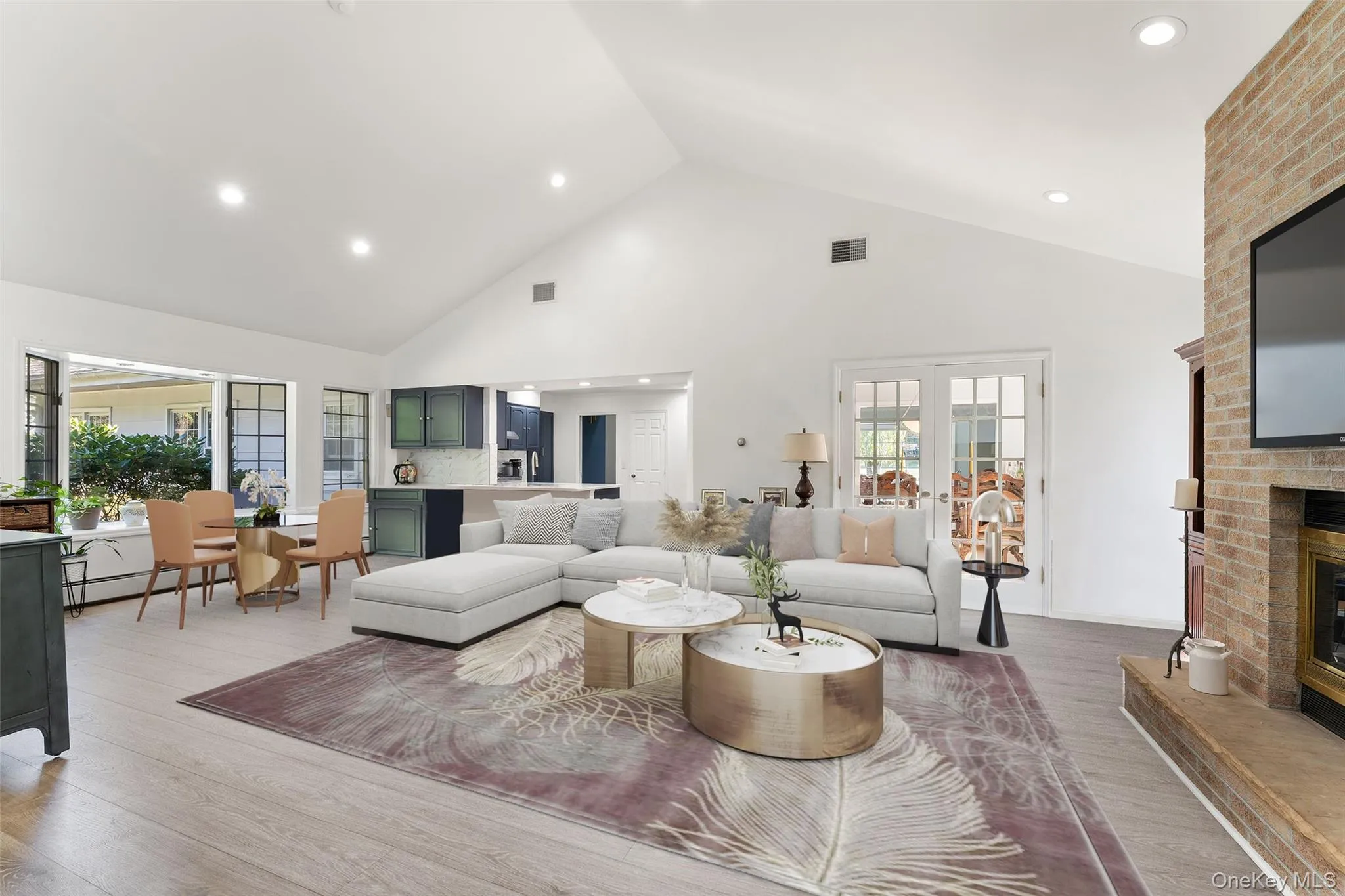 Family room open to the eat-in kitchen with French Doors to the Dining room and a wood burning fireplace. Virtually staged couch. Family room open to the eat-in kitchen with French Doors to the Dining room and a wood burning fireplace. Virtually staged couch.
