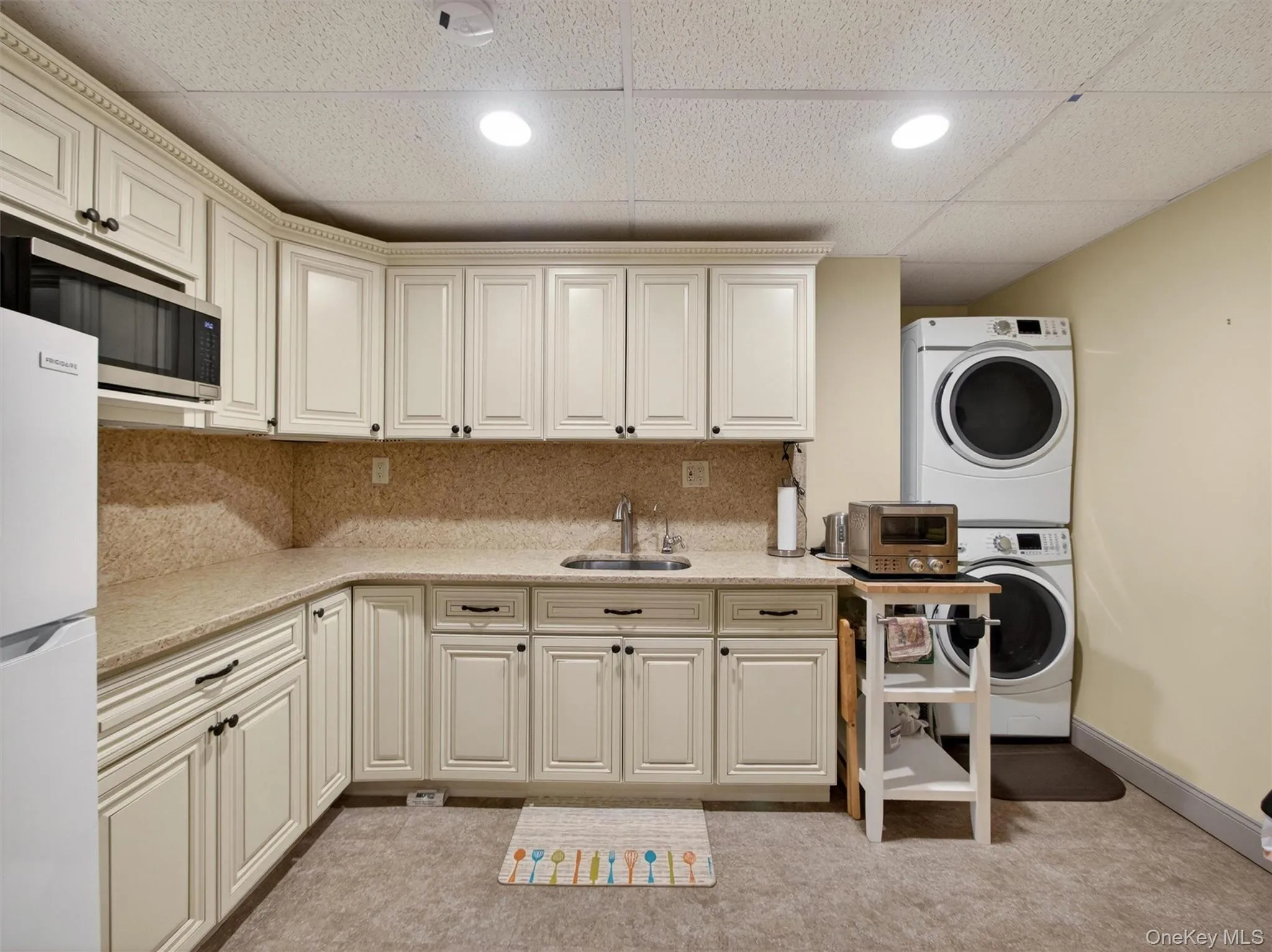 Kitchenette and laundry on lower level Kitchenette and laundry on lower level