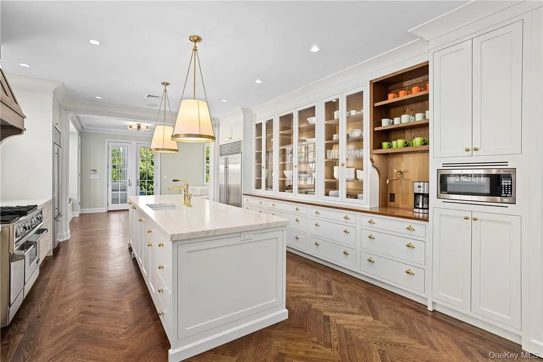This brand new kitchen dazzles with rows of fully custom inset cabinetry, upscale appliances This brand new kitchen dazzles with rows of fully custom inset cabinetry, upscale appliances
