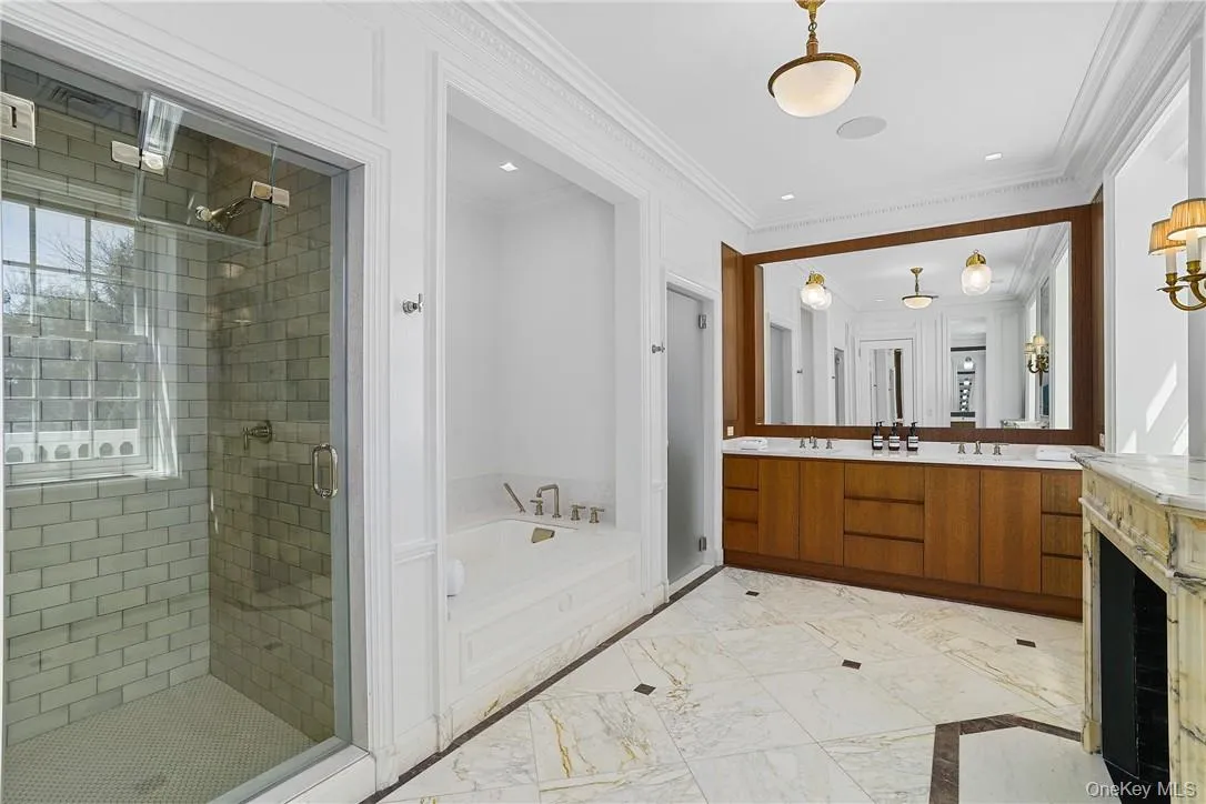 Spa bathroom also has a steam shower and soaking tub Spa bathroom also has a steam shower and soaking tub