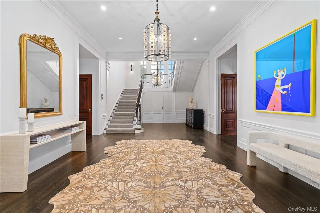 Grand entry foyer introduces rich hardwood floors, high ceilings and an intelligently reimagined layout. Grand entry foyer introduces rich hardwood floors, high ceilings and an intelligently reimagined layout.
