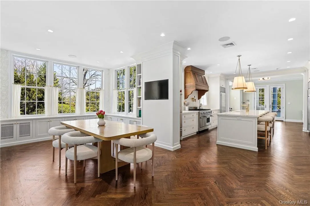 Fully renovated eat in kitchen and breakfast area with new herringbone white oak floors Fully renovated eat in kitchen and breakfast area with new herringbone white oak floors