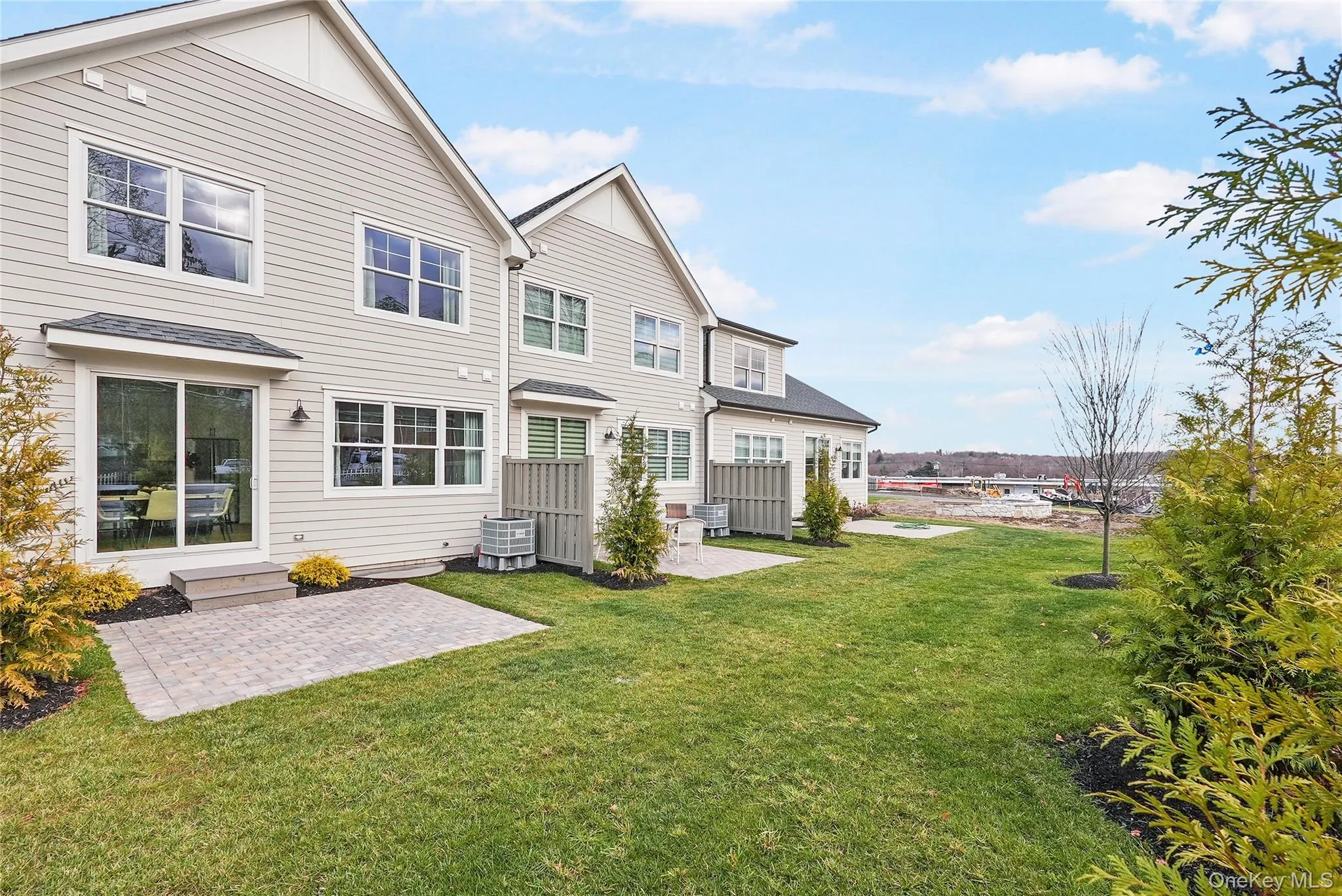 Rear view of house with a yard, central AC unit, and a patio Rear view of house with a yard, central AC unit, and a patio