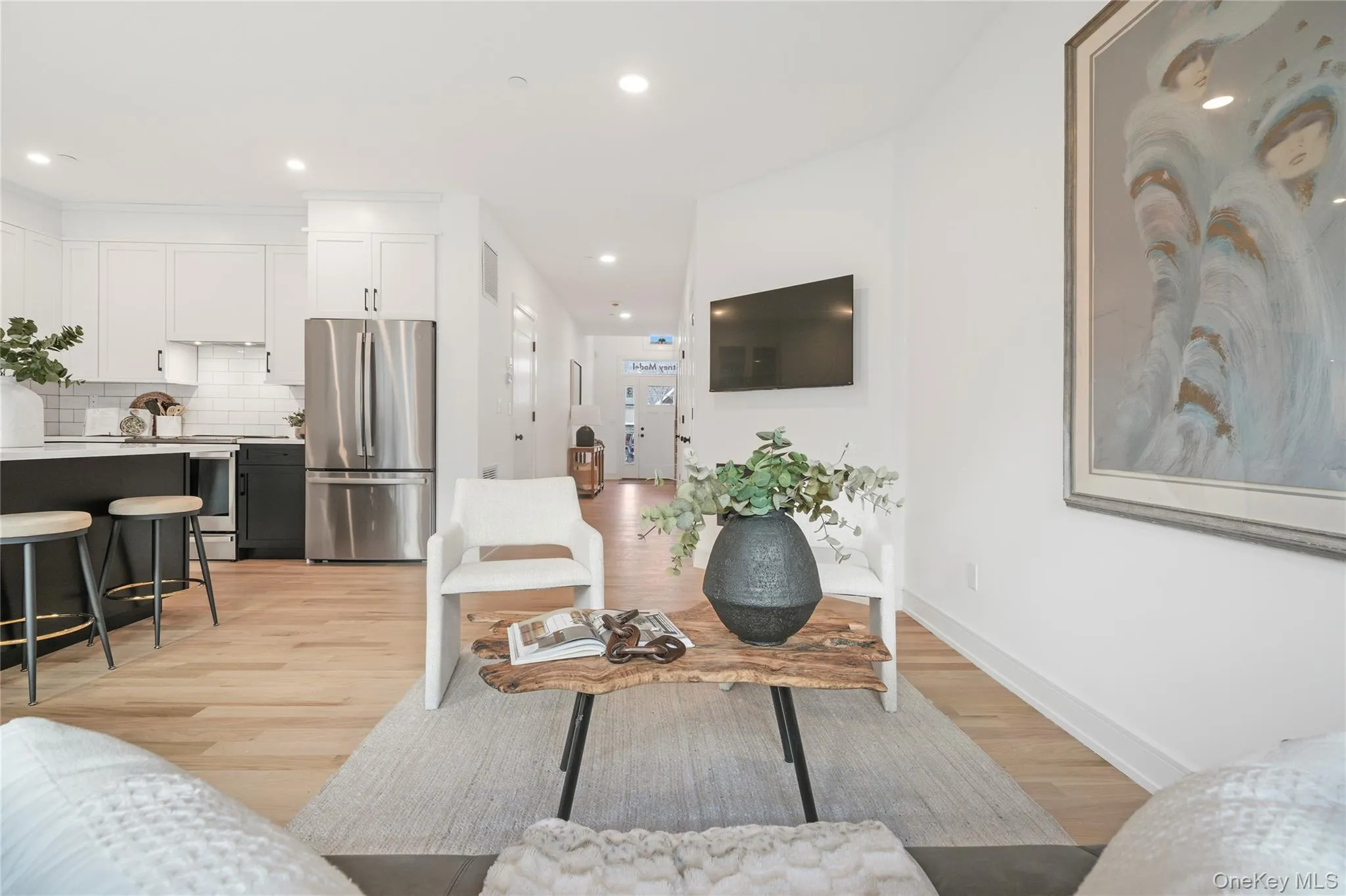 Living room featuring light hardwood / wood-style flooring Living room featuring light hardwood / wood-style flooring