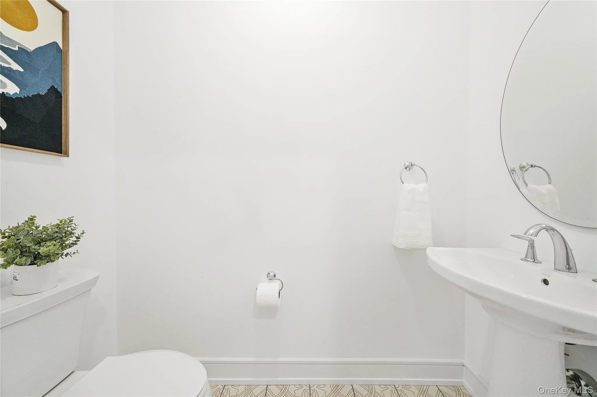Bathroom featuring sink and toilet Bathroom featuring sink and toilet