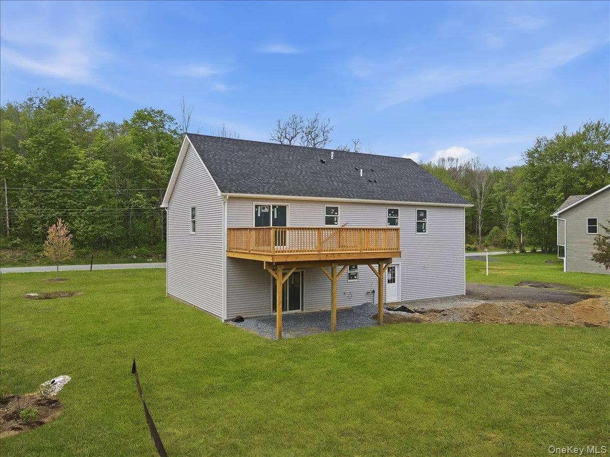 Spacious rear deck overlooking a beautiful level yard — perfect for entertaining, gatherings, or future outdoor enjoyment. Spacious rear deck overlooking a beautiful level yard — perfect for entertaining, gatherings, or future outdoor enjoyment.