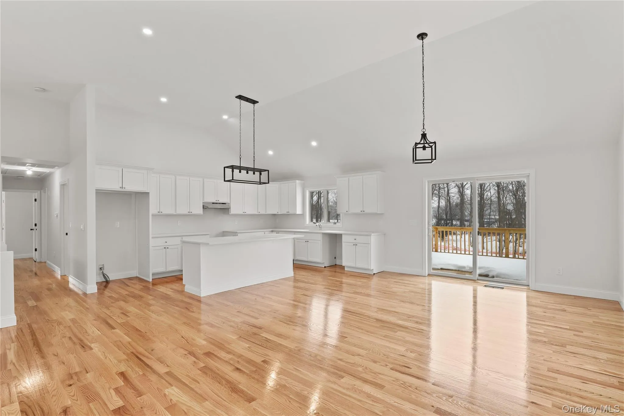 Finished kitchen from neighboring home #107 shown for reference — builder has ordered the same white cabinetry for this home. Finished kitchen from neighboring home #107 shown for reference — builder has ordered the same white cabinetry for this home.