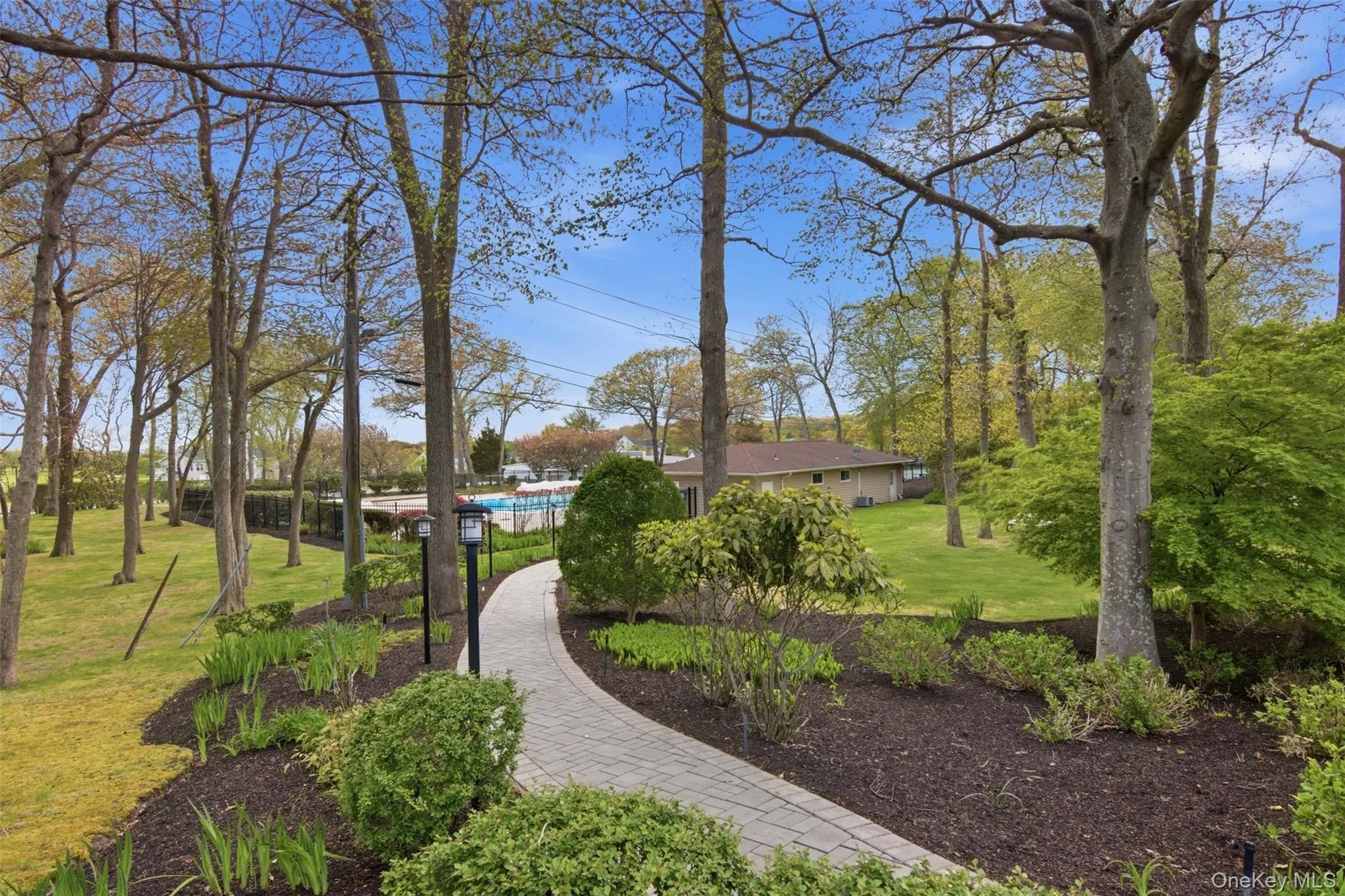 Pathway, Right Across from Your Condo to the Community Pool, Clubhouse, and Workout Room Pathway, Right Across from Your Condo to the Community Pool, Clubhouse, and Workout Room