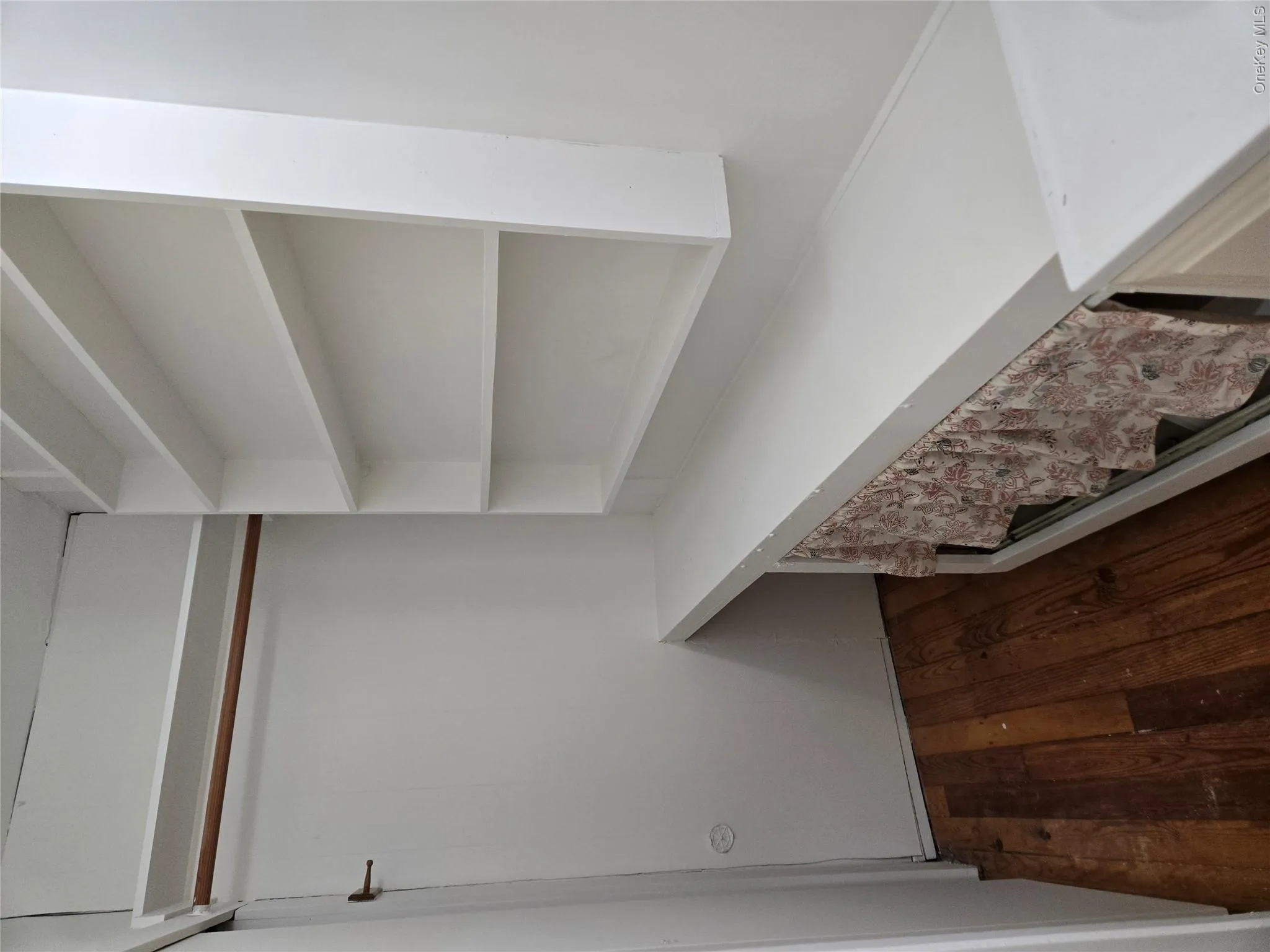 storage shelves to right, double closet to left storage shelves to right, double closet to left