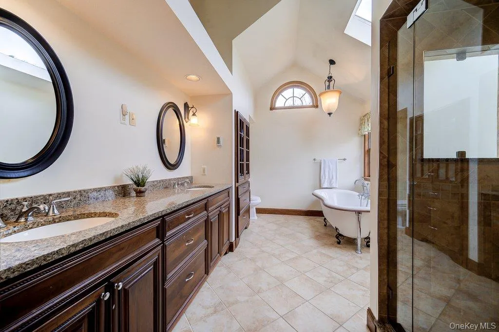Well appointed and light-filled primary bath with double sinks, separate shower and lovely soaking tub! Well appointed and light-filled primary bath with double sinks, separate shower and lovely soaking tub!