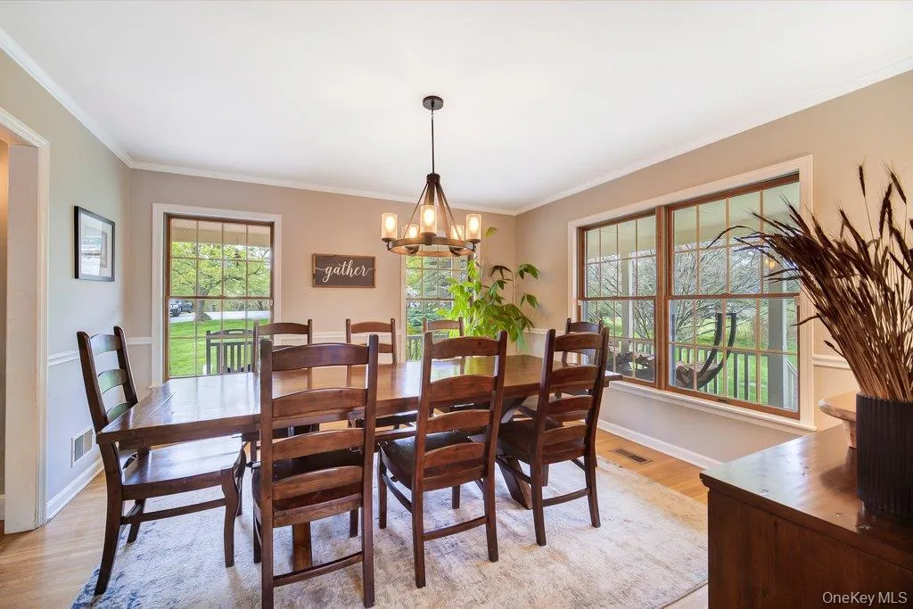 Enjoy entertaining and holiday memories in this beautiful separate dining room with wrap-around porch views. Enjoy entertaining and holiday memories in this beautiful separate dining room with wrap-around porch views.