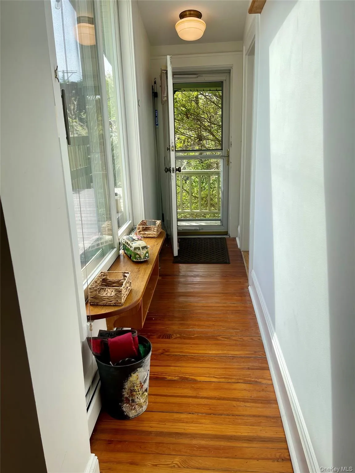 hallway of the second entrance of the apartment. Sliding door on the left to the private deck hallway of the second entrance of the apartment. Sliding door on the left to the private deck